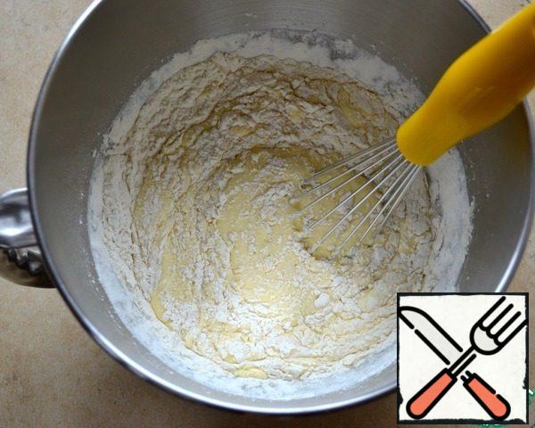 Sift flour with baking powder and add to egg mixture. Stir until smooth.