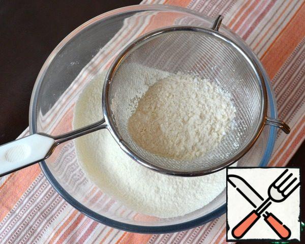 Turn the oven to warm up to 180 degrees. Sift flour with baking powder.