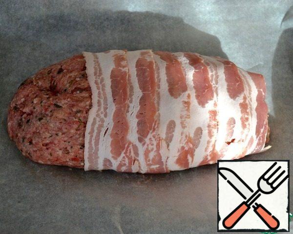 Wrap the whole surface with strips of bacon.