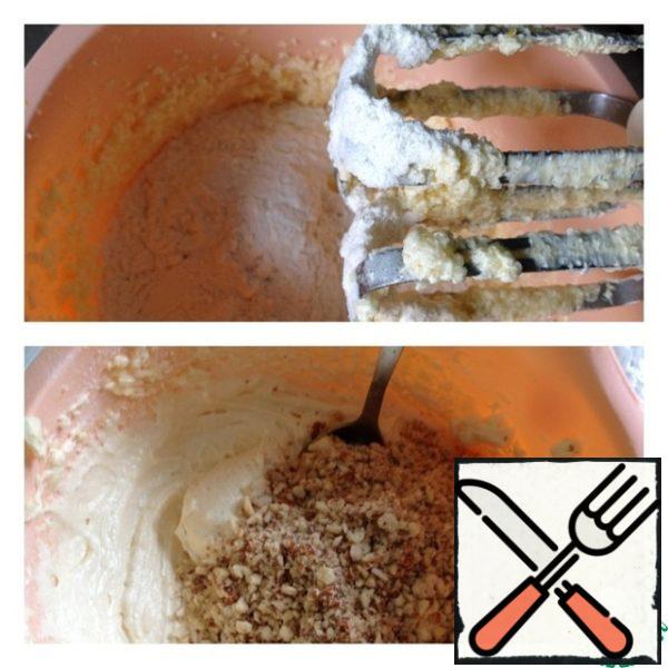 Add baking powder and flour, whisk. Nuts grind in a blender and add to the dough, mix gently.