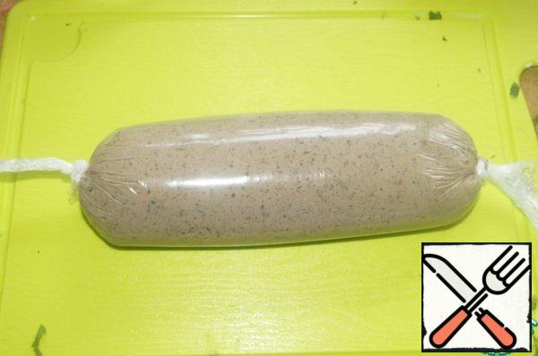 Put the pate on plastic wrap. Wrap it in pate giving it a cylindrical shape. The size of the pate sausage should be slightly smaller than the shape for the terrine. Put the pate in the freezer. Pate should take the form of, but not freezing.