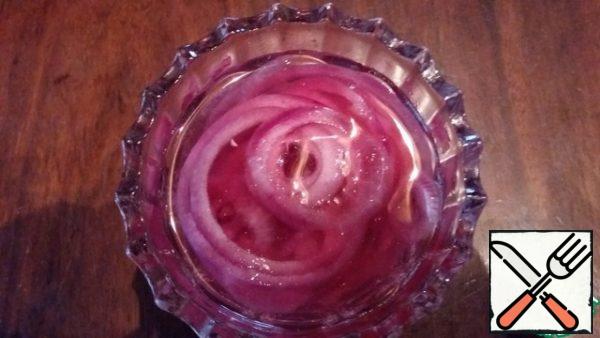 Red onions cut into thin rings and marinate if desired.