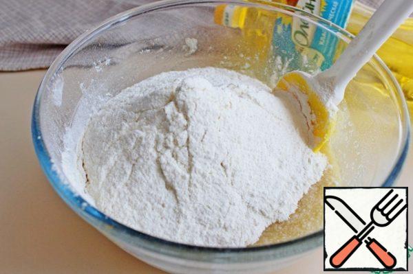 Add the sifted flour, vanilla sugar and baking powder.
