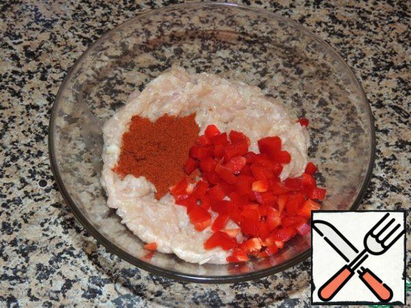 For the red layer, add half of the minced paprika and cut into small cubes of red pepper.