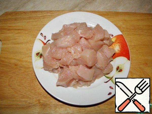 Chicken fillet cut into small pieces.