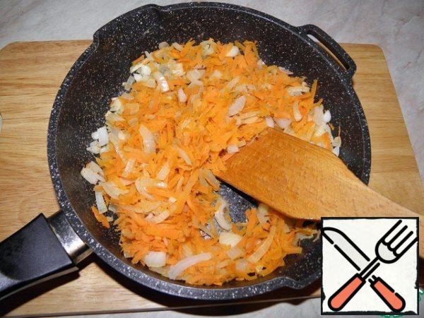 Grate the carrots, chop the onion and fry in a pan.