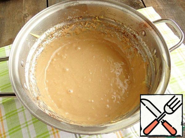 In the remaining half of the dough, sift the cocoa powder, mix well.
