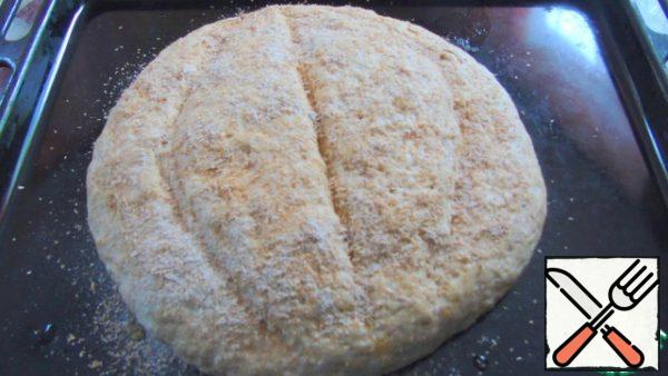 As the bread will fit, cut, lubricate with milk and sprinkle with bran, that remained from sifting.
Send in preheated to 200 C for 35 minutes.