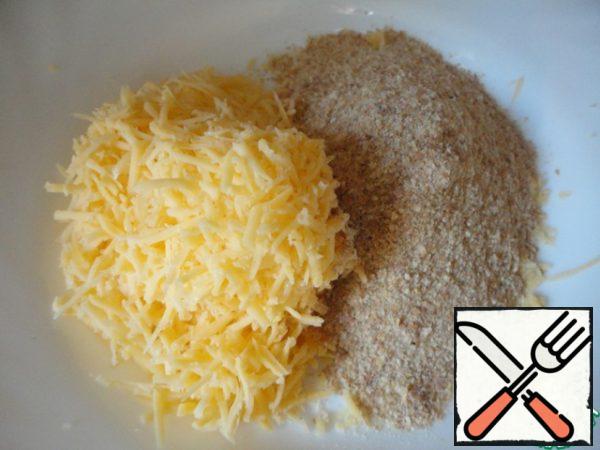Cheese three on a fine grater, add to breadcrumbs.