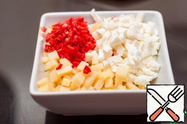 Mozzarella and Cheddar cut into small cubes or grate, mix with finely chopped hot red chili peppers, peeled from seeds. You can replace Chile with diced red peppers, if you don't like spicy.