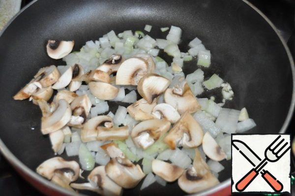 Add the sliced mushrooms and fry for a couple of minutes.
