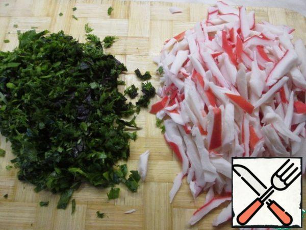 Crab meat cut into strips, finely chop the greens.