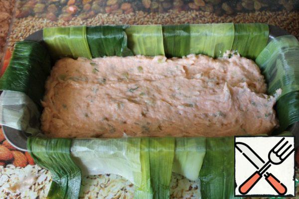 Put half of the salmon mousse in a terrine dish.
