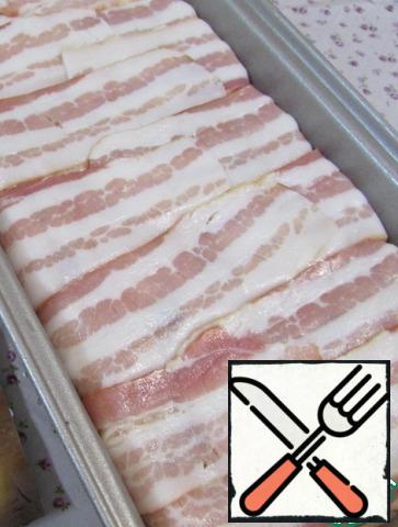 To close the hanging edges of the bacon.