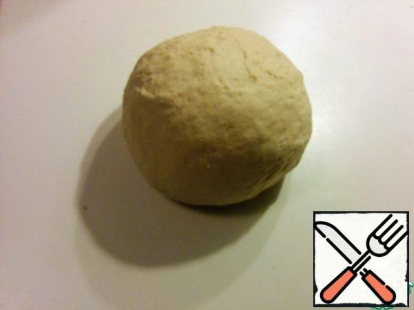 Knead the dough for 5 minutes. Cover with a towel, leave to increase the volume twice.