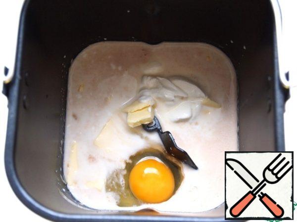 In warm milk to dissolve yeast. Add sugar, salt, sour cream, egg and melted butter.