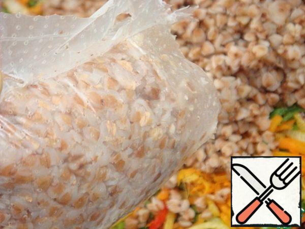 Carefully open the bag on the side and put the buckwheat groats to the vegetables.
