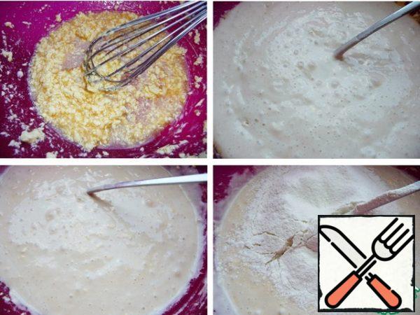 Add the sourdough, mix, and add the sifted flour in parts.

