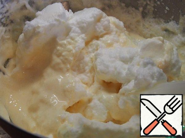 In the yolk mass add the beaten egg whites. Stir lightly.