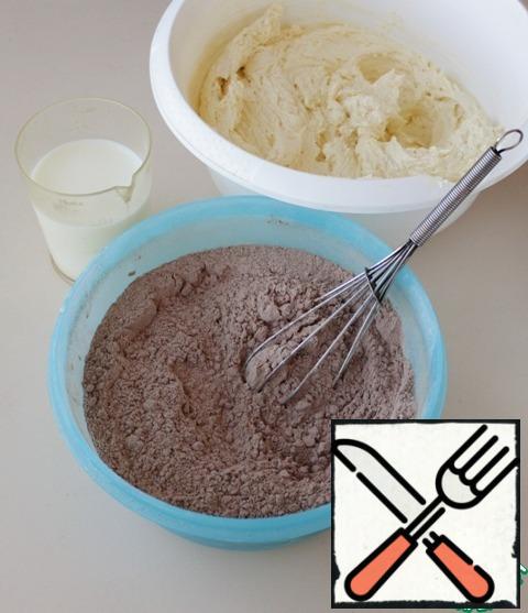 Well stir the sifted flour with cocoa and baking powder or sift all together, combine all components, add milk.