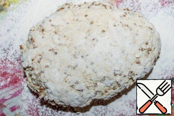 Place the dough on a floured board and knead until it stops sticking to your hands.
