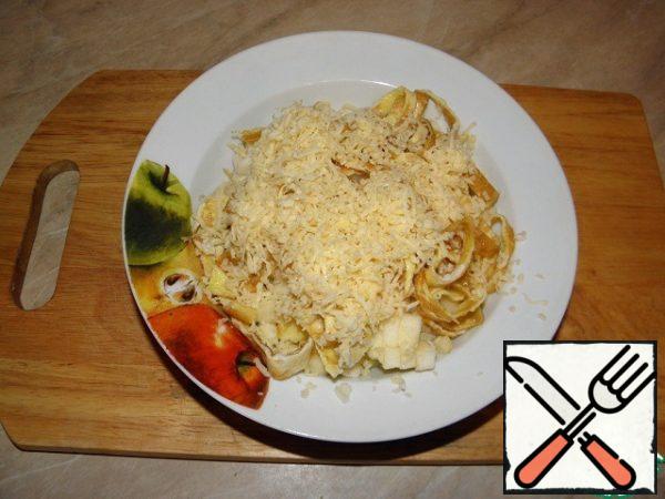 GRATE the cheese on a medium grater.
