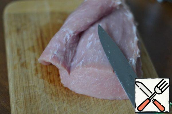 With a sharp knife carefully, in a spiral, begin to cut the meat.