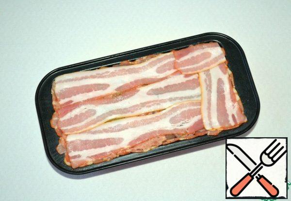 Top with strips of bacon.
