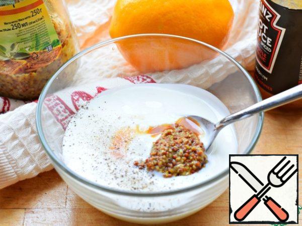 Yogurt mix with granular mustard (you can use the usual 1/2 tsp) and Tabasco sauce or any other hot sauce. Pour lemon juice (1 tsp) and salt.