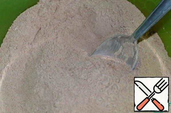 Preheat the oven to 180 *C.
In a bowl, mix the sifted flour with baking powder, sugar, cocoa and salt.