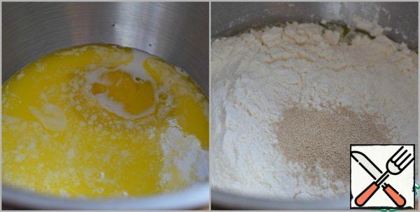 Mix egg, milk at room temperature, salt, sugar and melted (BUT not hot!) butter. Add the sifted flour and yeast.
