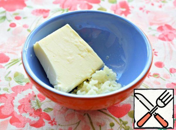 Mix soft butter with garlic passed through the press.