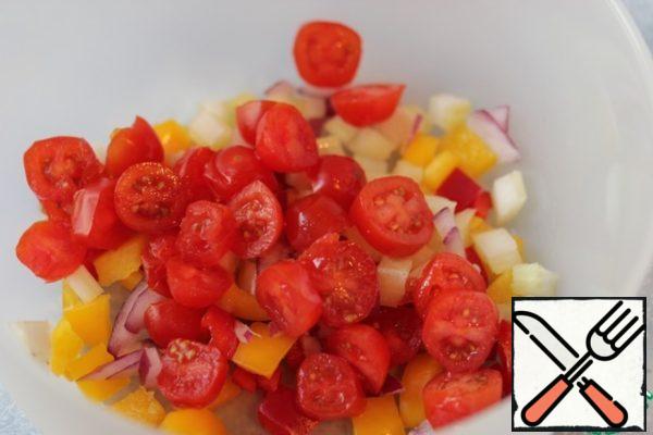Pepper, onion and celery cut into small cubes, cherry tomatoes cut into halves.
