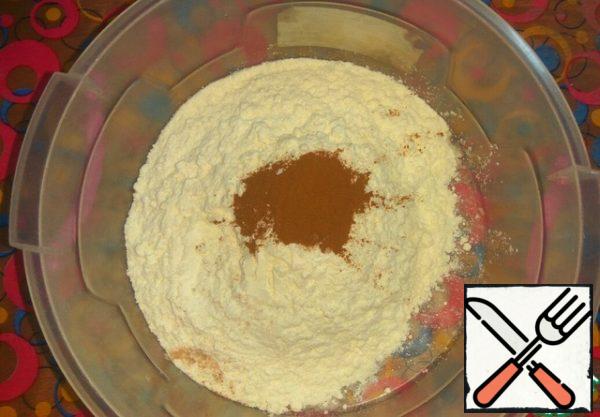 In a bowl, mix flour, baking powder, salt and cinnamon. Stir.