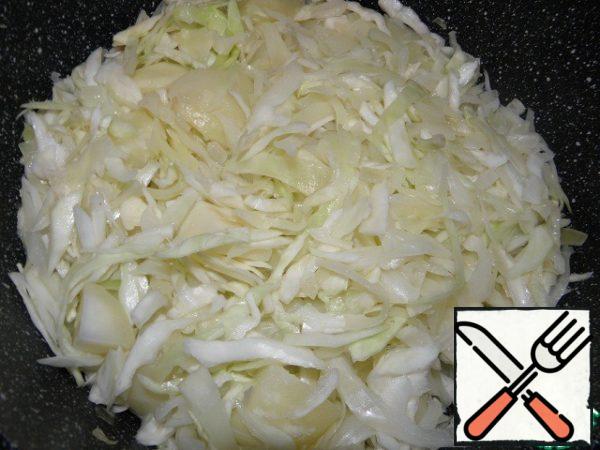 Add potatoes and cabbage to the pan and mix thoroughly.