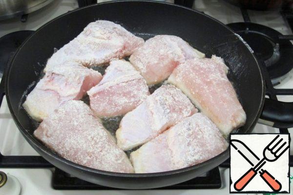 Add vegetable oil to the pan (5 tablespoons). Add the pieces of walleye to the pan.