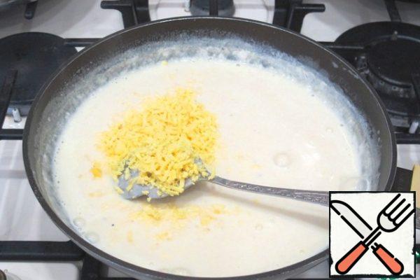 Add the yolk shavings to the milk sauce, then add the chopped egg white. Sauce remove from heat.