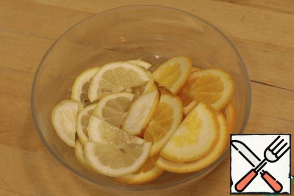 Lemon and orange cut into semi-circles.
