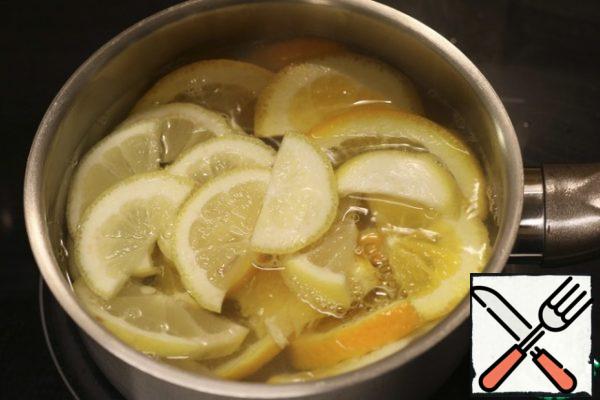 Bring to a boil 150 ml of water, blanch it all citrus 1 minute. Then the operation is repeated again (heat 150 ml and blanch the citrus). Drain the water. This will help remove the bitterness from the peel.