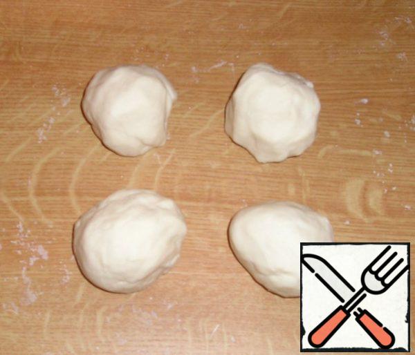 Divide the dough into several equal pieces.