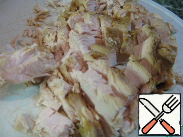 Cut chicken breast.