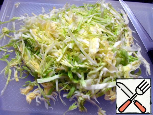 Chop the cabbage, add salt and lightly drench.
