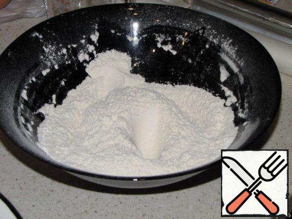 In a separate container sift the flour, baking powder, salt and vanillin. Stir.