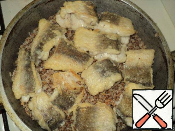 On buckwheat spread fried fish (fillet).