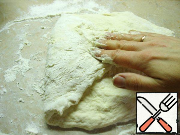 Now fold the dough like an envelope, slightly pulling each edge.
