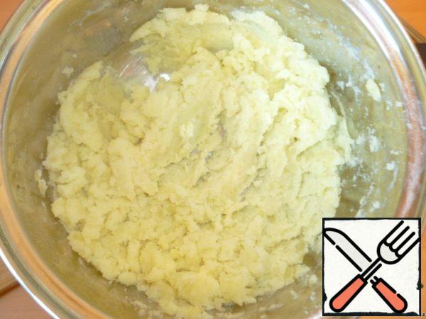 Boil the potatoes in salted water and mash until smooth.
