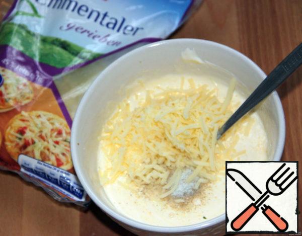 Add 1/2 of the grated cheese.