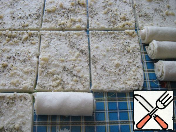 Roll the rectangles into rolls.