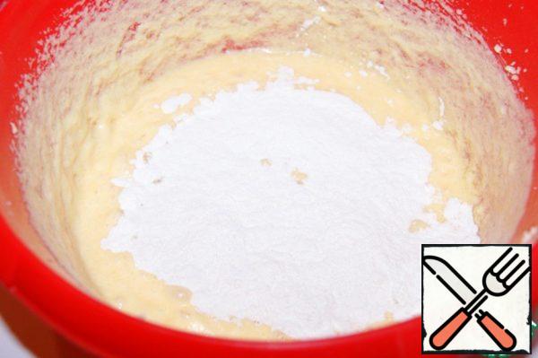 Add the flour mixed and sifted with baking powder and mix with a spatula.
