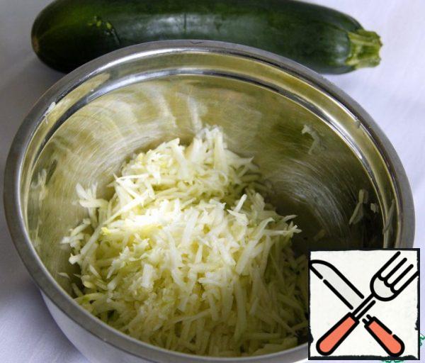 Zucchini peel, get rid of large seeds and grate.